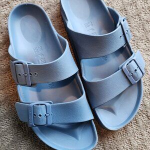 Birkenstock Arizona Essentials EVA sandals in the "Popcorn" (light blue) color